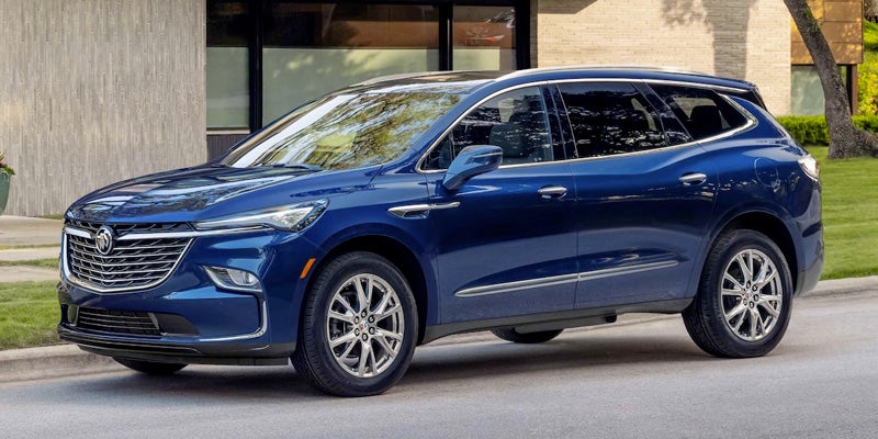 Blue 2023 Buick Enclave parked in driveway