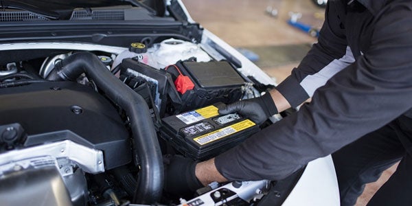 Battery being replaced in Buick vehicle by Service Technician