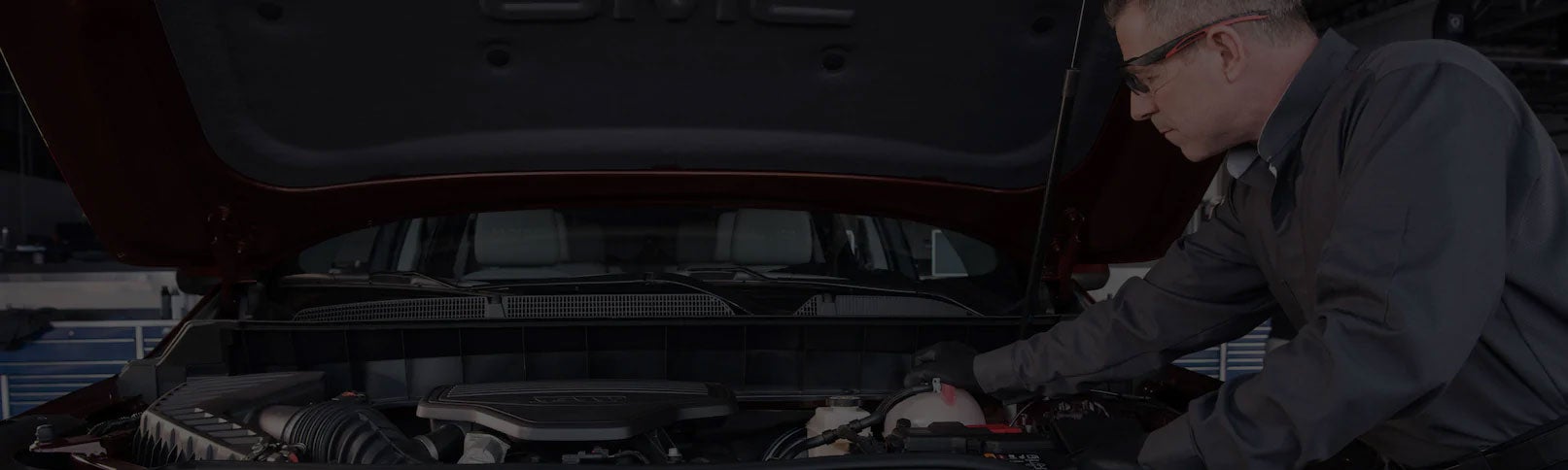 A GM Certified Service Technician performing maintenance work on a GM vehicle