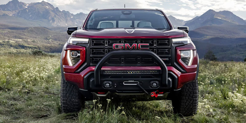 Red GMC pickup truck parked outdoors