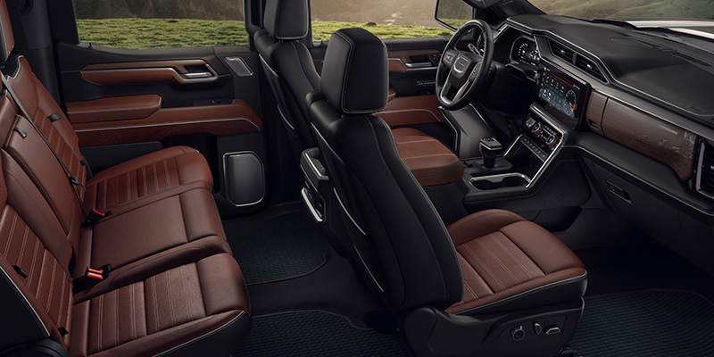 GMC Sierra 1500 interior with premium leather seats, spacious cabin, and modern dashboard features.